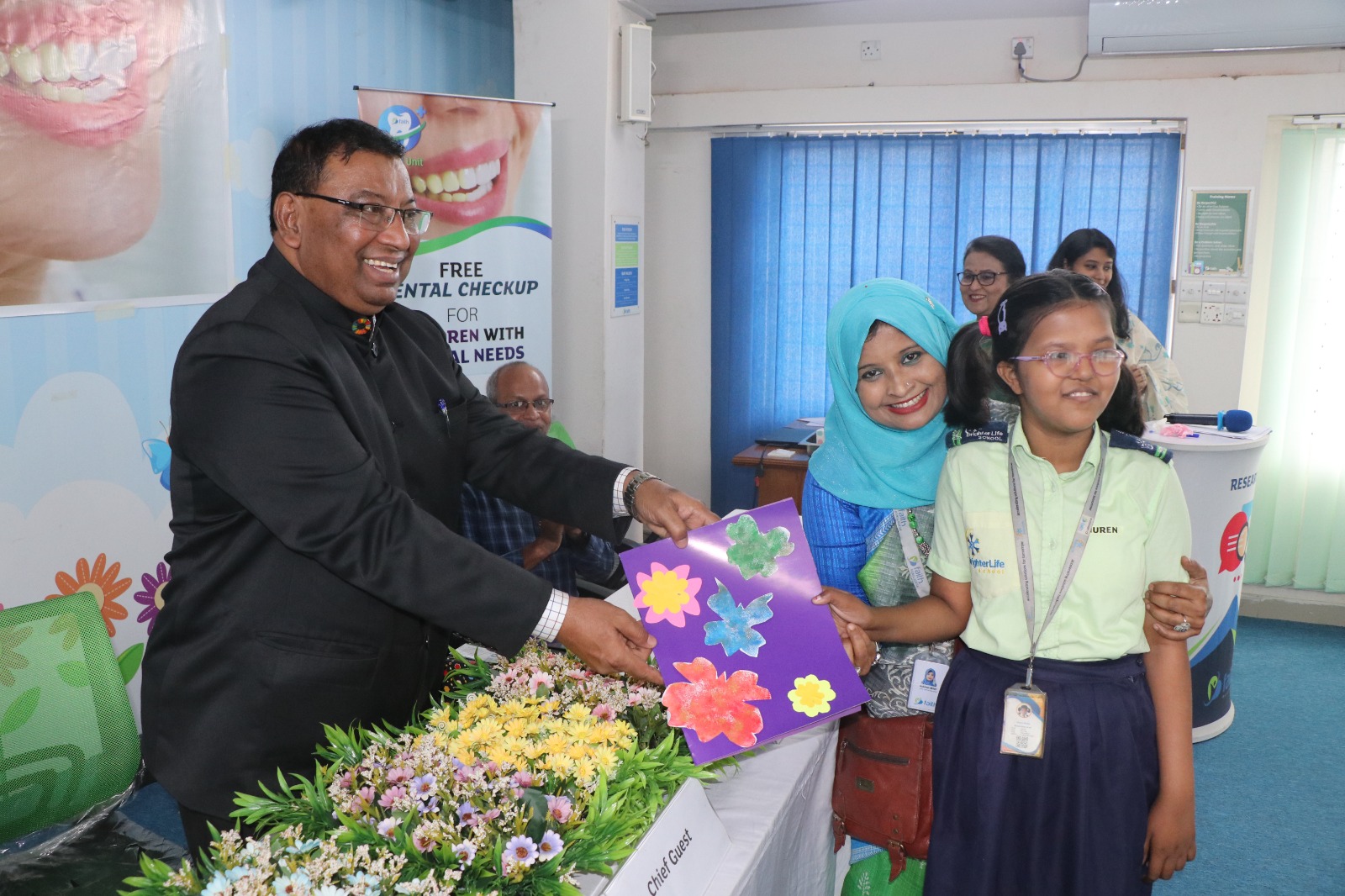 Chief_guest_receives_a_suvenir_from_a_child