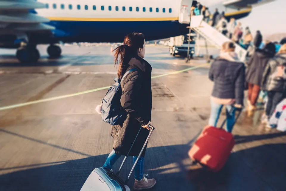 woman-waiting-queue-boarding-862016142