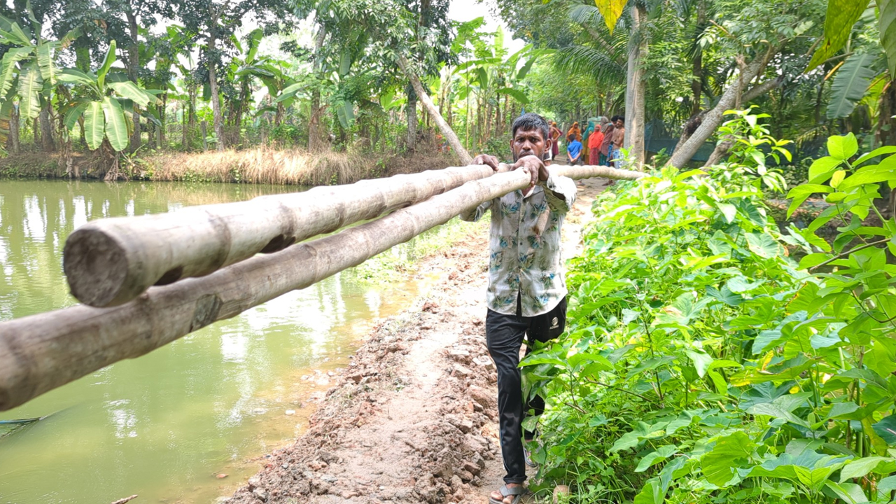 Road_in_Rajbari_cut_open_into_a_pond_1